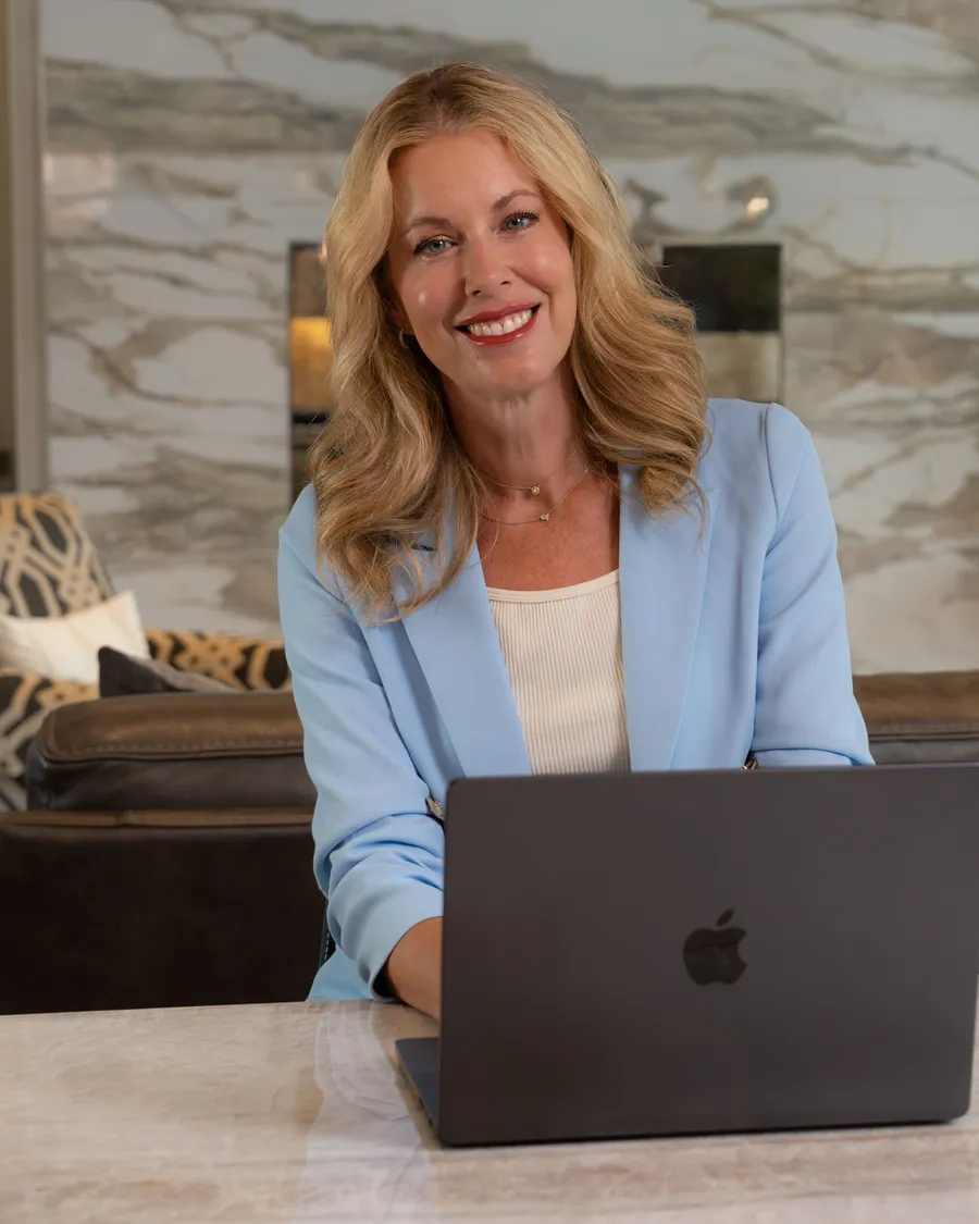 Cara Painter at her laptop, ready to answer your message