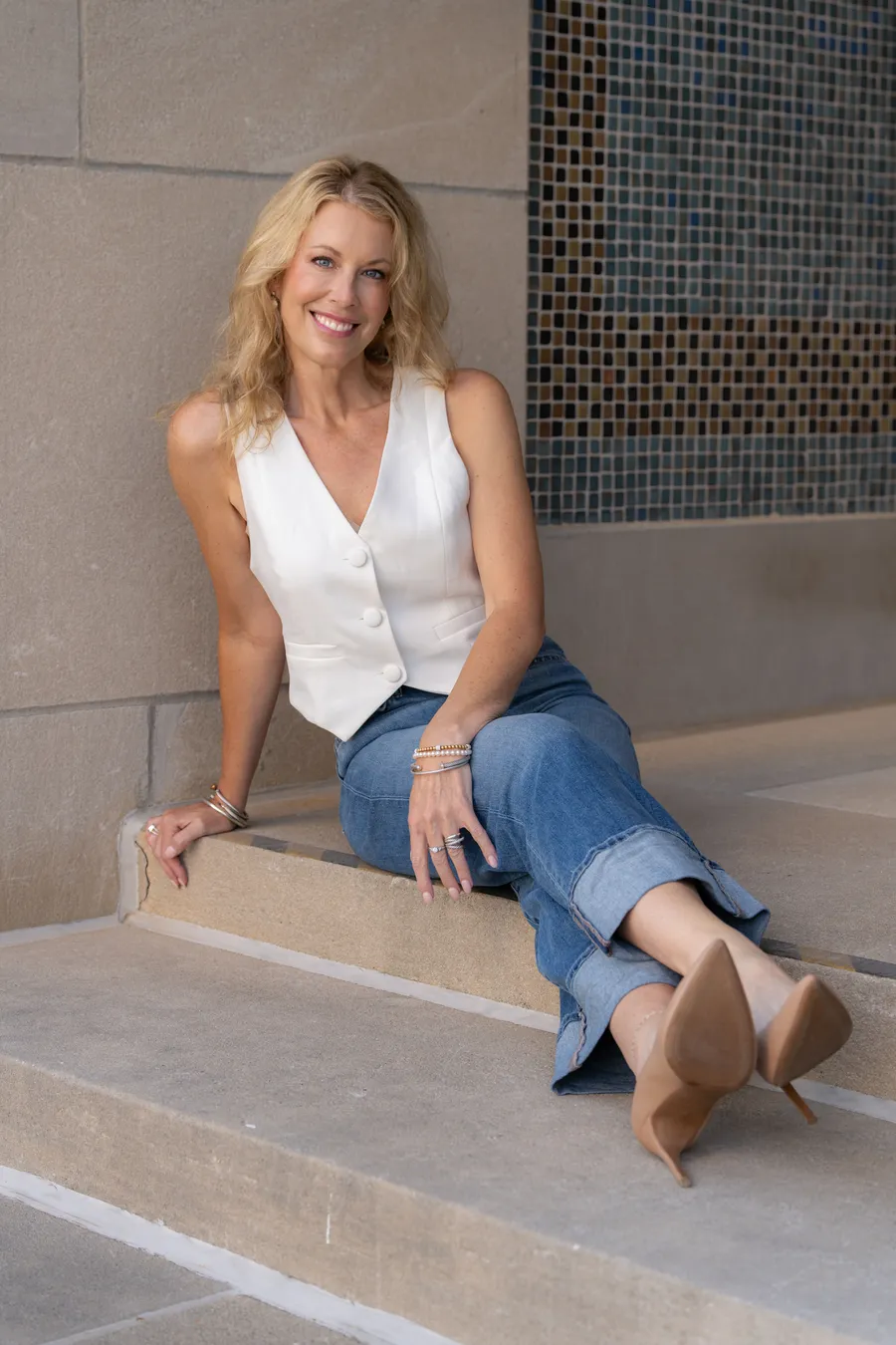 Cara Painter seated on stone steps in Kansas City